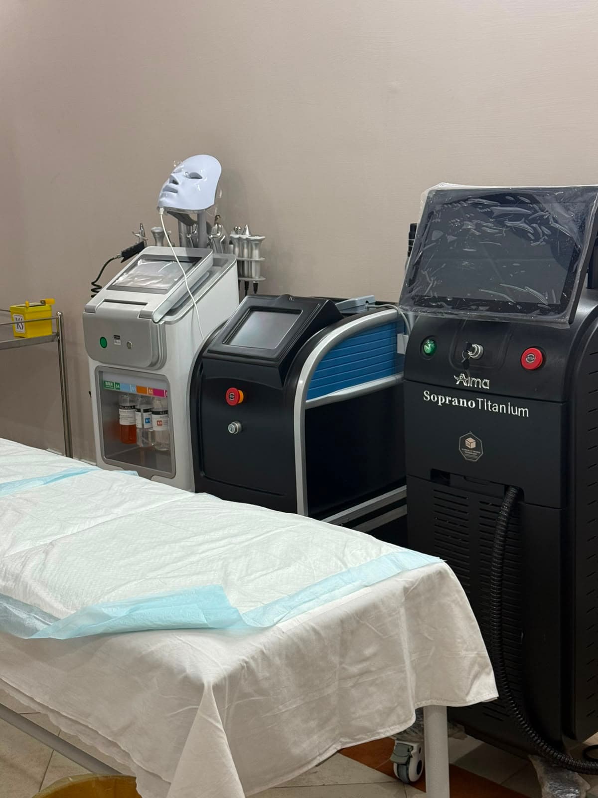 Aesthetic treatment machines and prepared clinical bed at Skin Lounge by Rasha.